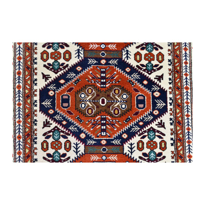 Central Ardabil medallion in rust orange and navy, surrounded by turquoise and burgundy motifs