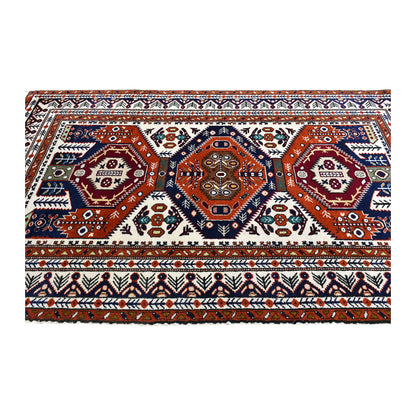 Field view of Persian Ardabil rug showing three aligned medallions and layered patterned borders