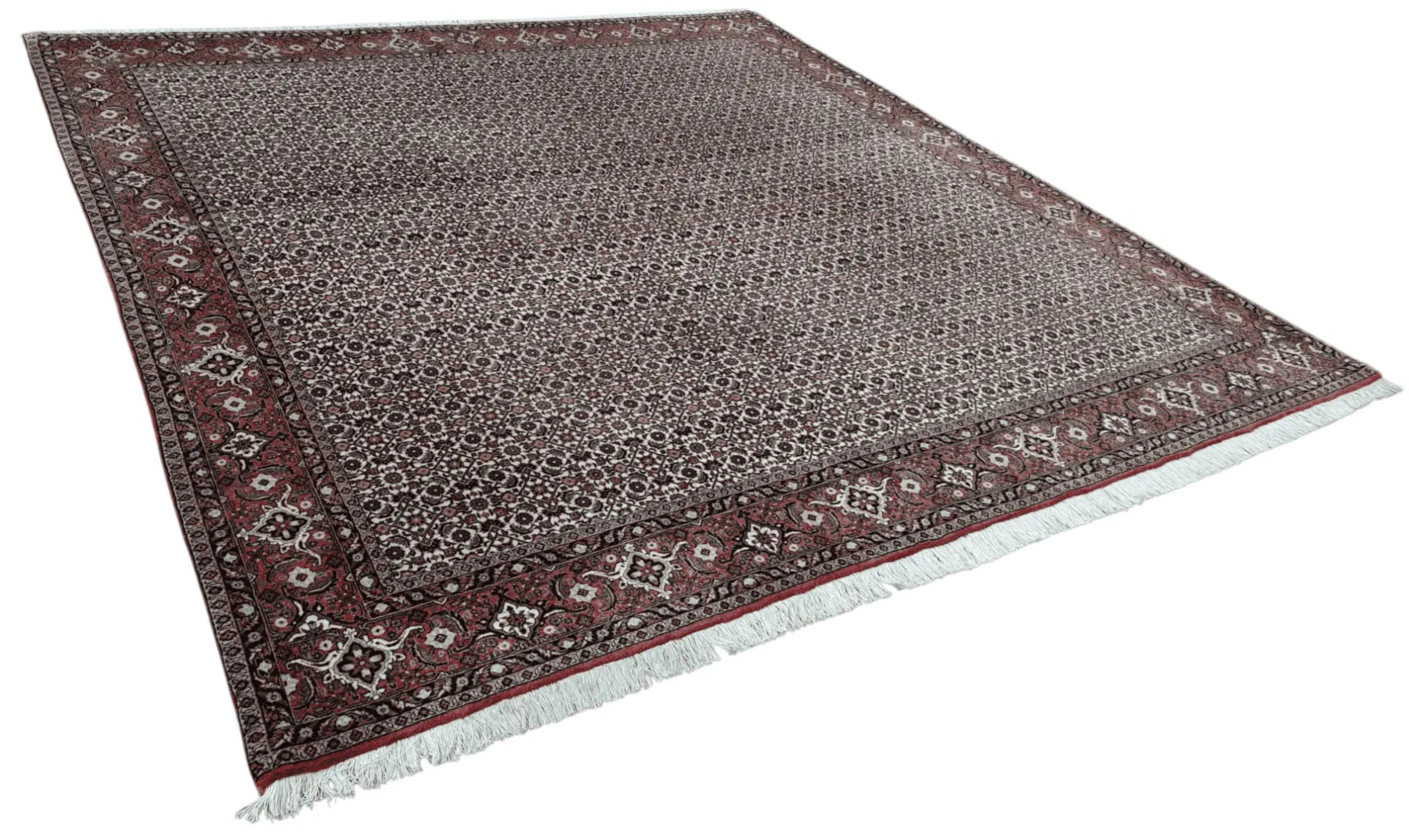 Angled view of Persian Bidjar hand-knotted wool rug showing dense wool pile, dark brown field and traditional border, 257 x 250 cm