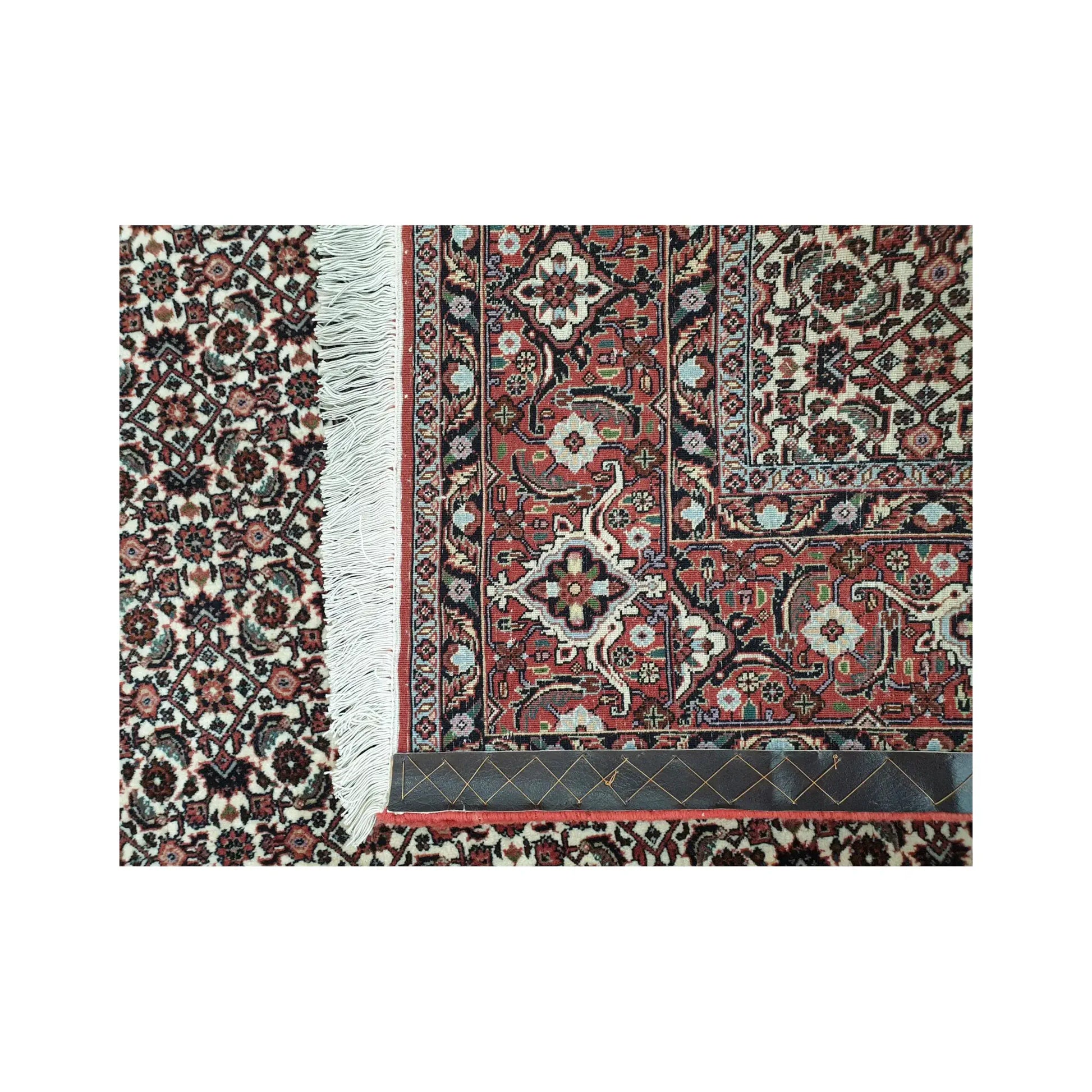 Back corner detail of Persian Bidjar hand-knotted wool rug showing reverse weave, border structure and fringe edge, 257 x 250 cm