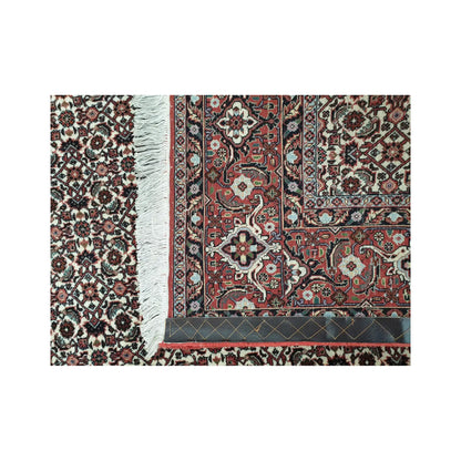Back corner detail of Persian Bidjar hand-knotted wool rug showing reverse weave, border structure and fringe edge, 257 x 250 cm