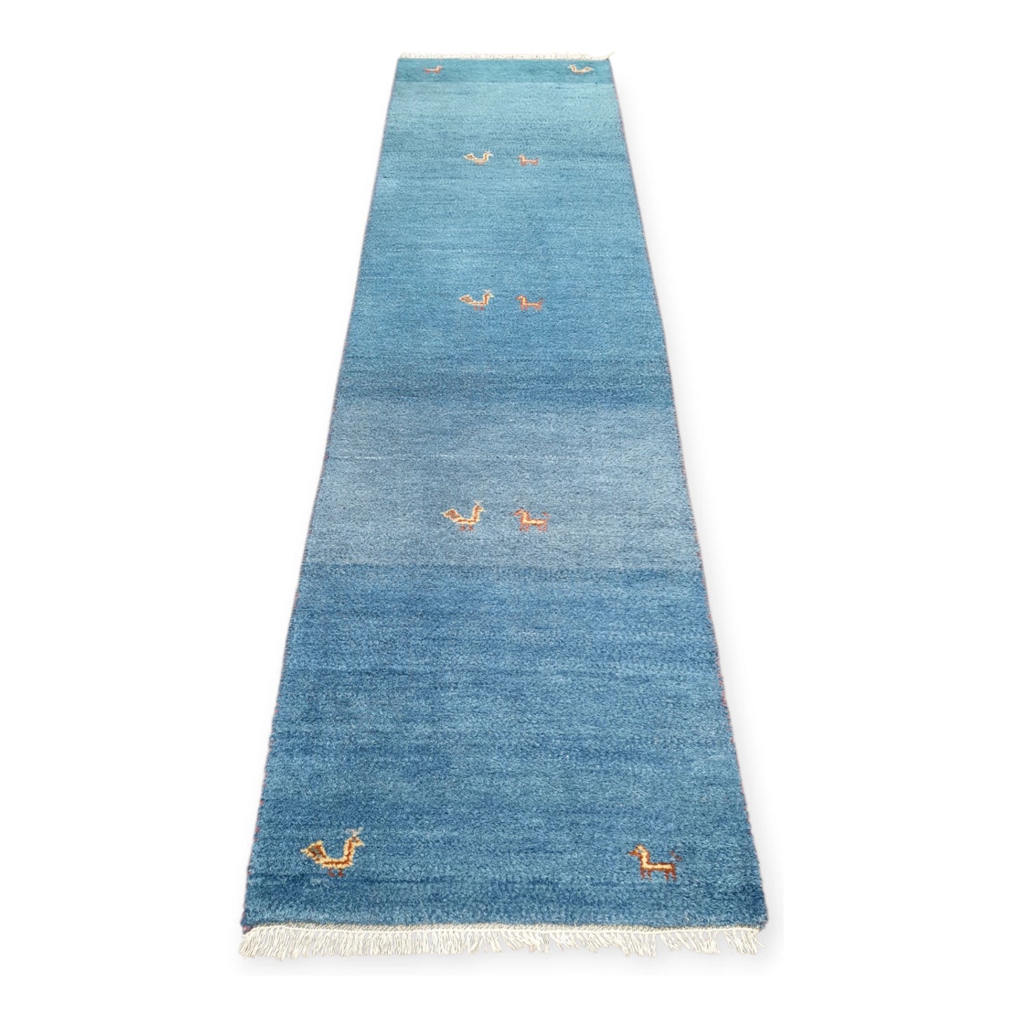 Full view of blue Persian Gabbeh hand-knotted wool runner rug with sparse orange geometric motifs, 300 x 80 cm