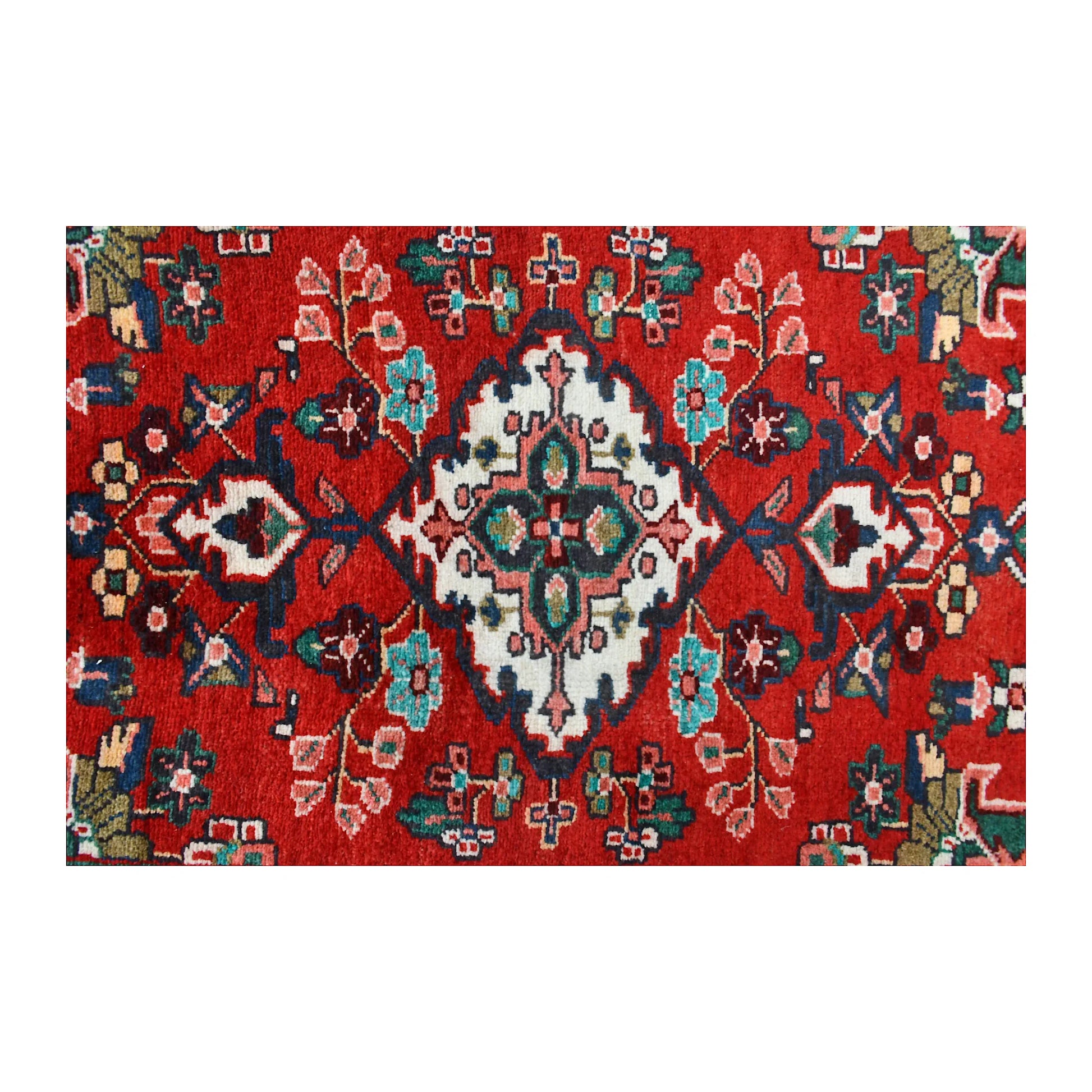Close-up of Persian Hamadan runner showing an ivory floral diamond medallion with turquoise and green details