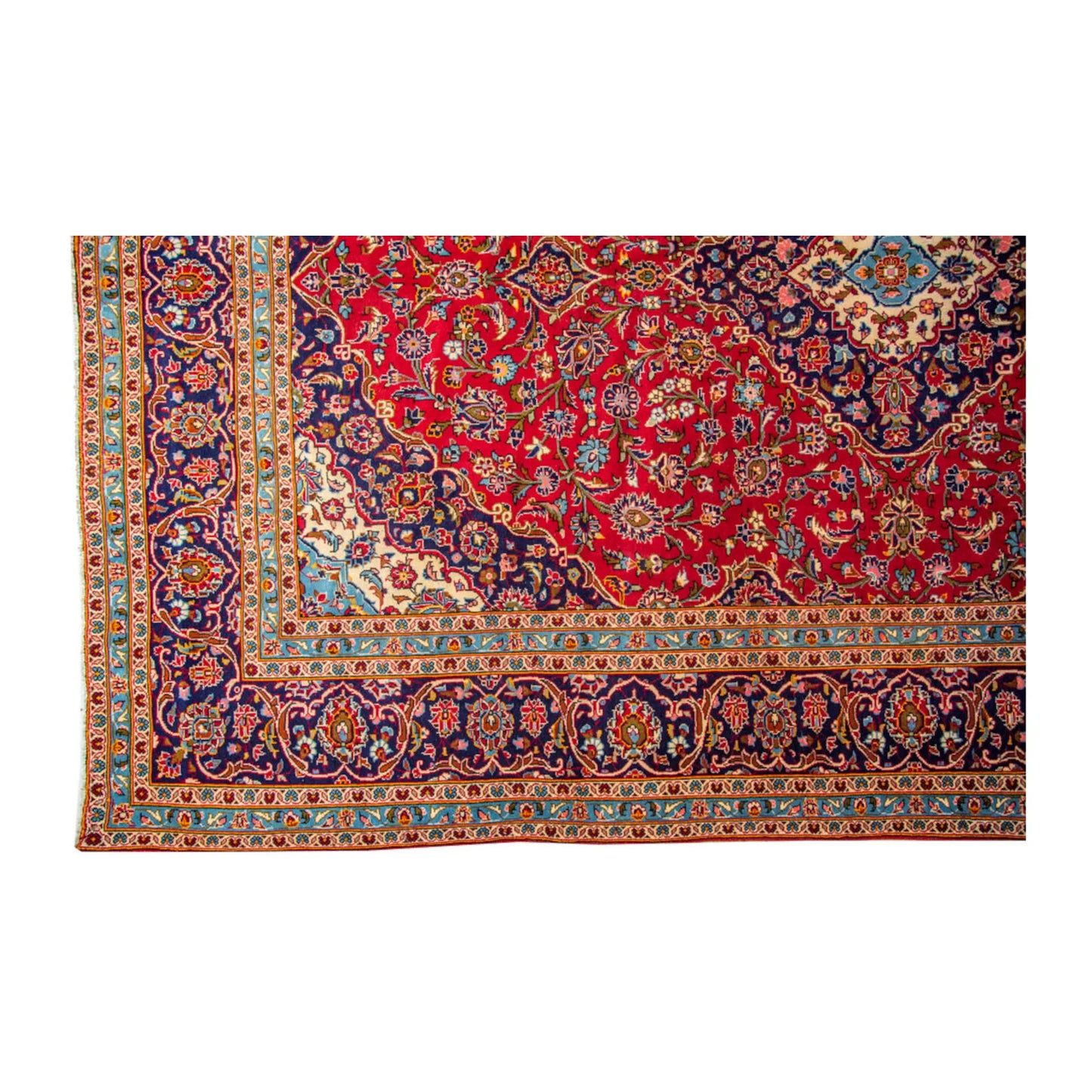 Border and fringe detail of Persian Kashan hand-knotted wool rug showing blue, beige and floral pattern work