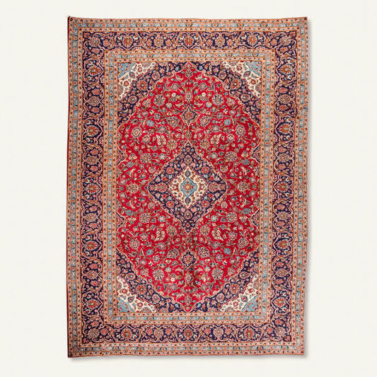 Persian Kashan hand-knotted wool rug 405 x 285 cm full view with red central medallion and blue floral border