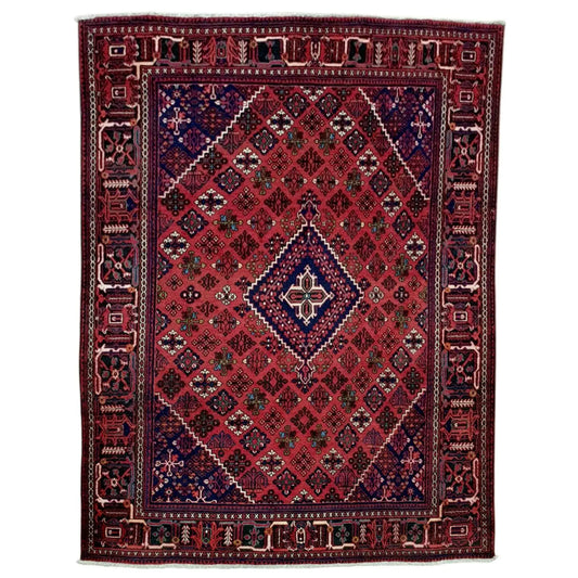 Full view of Persian Meimeh hand-knotted wool rug, 300 x 210 cm, with a red field and navy diamond medallion