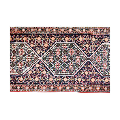Diamond lattice detail of Persian Senneh runner with ivory linked medallions and intricate multicolour field pattern