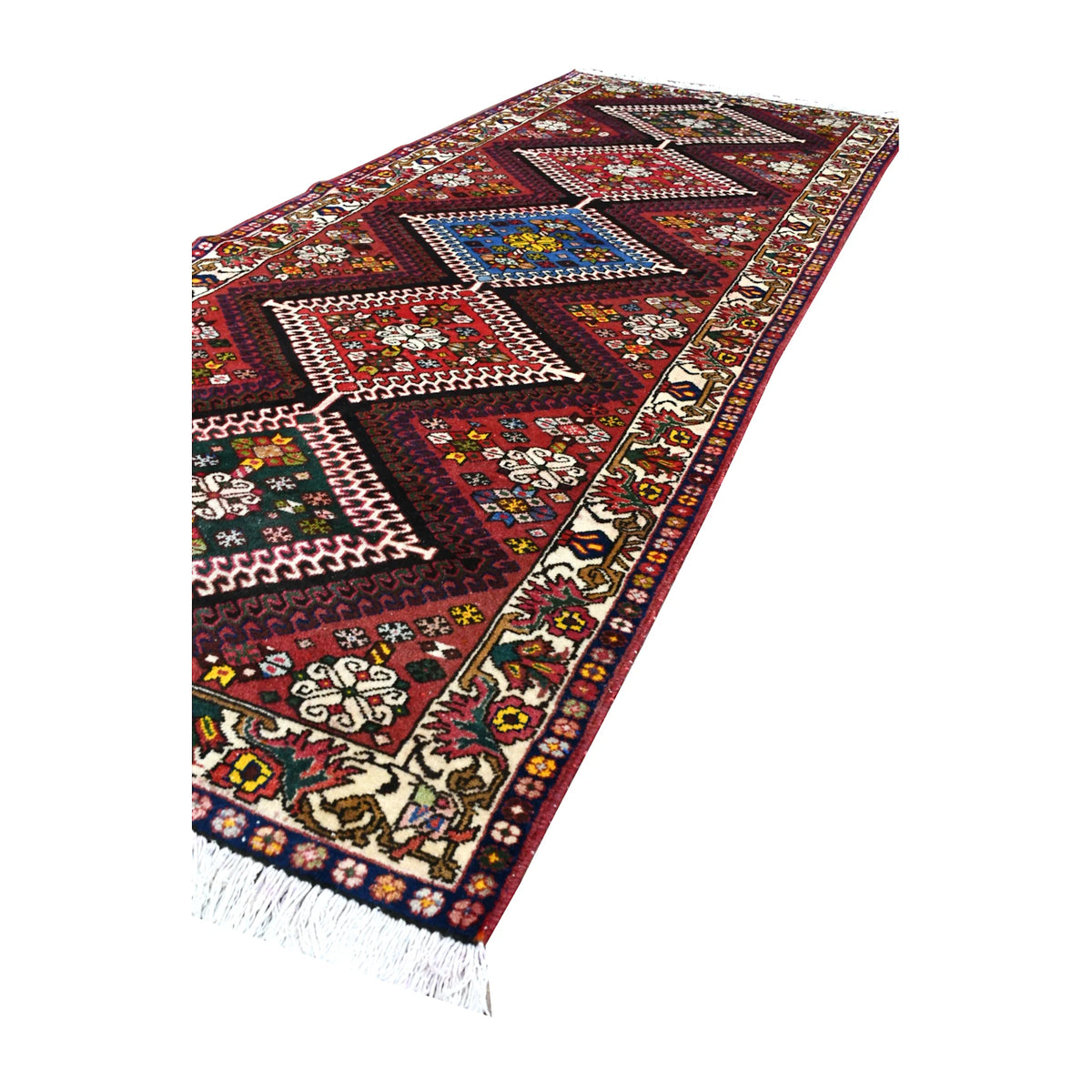 Angled full-length view of Persian Shiraz runner showing the five-medallion arrangement, floral borders and ivory fringe