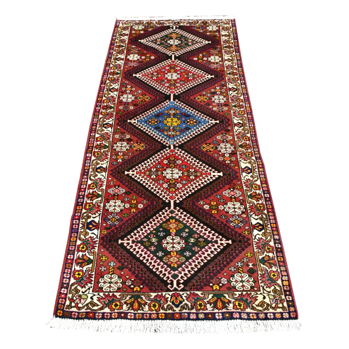Full view of vintage Persian Shiraz runner rug with five vertically aligned diamond medallions on a deep red field, 302 x 125 cm