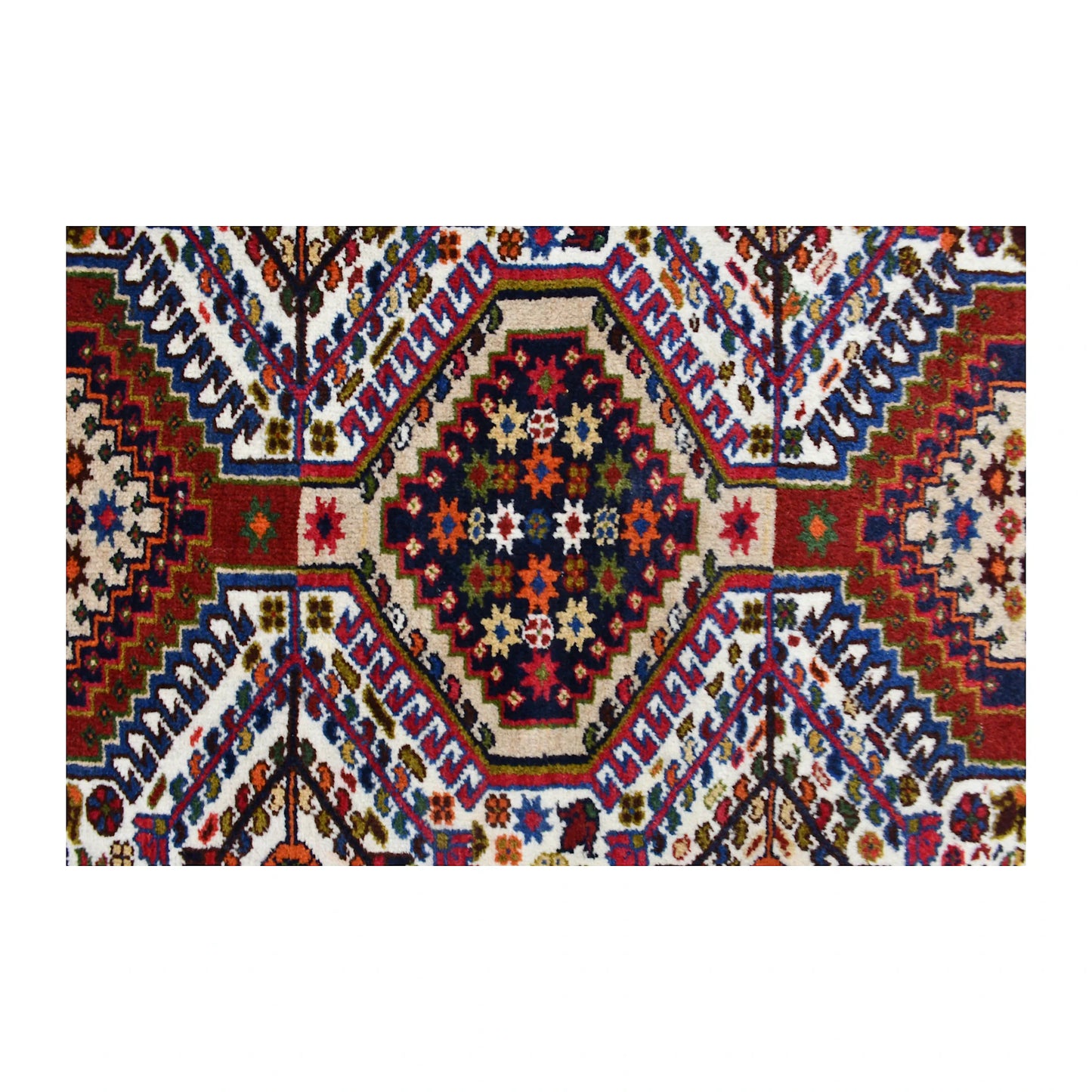 Close-up of the central Yalameh medallion showing stepped outlines and multicoloured geometric detail