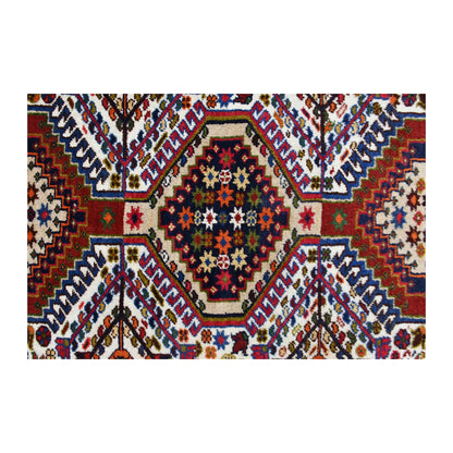 Close-up of the central Yalameh medallion showing stepped outlines and multicoloured geometric detail
