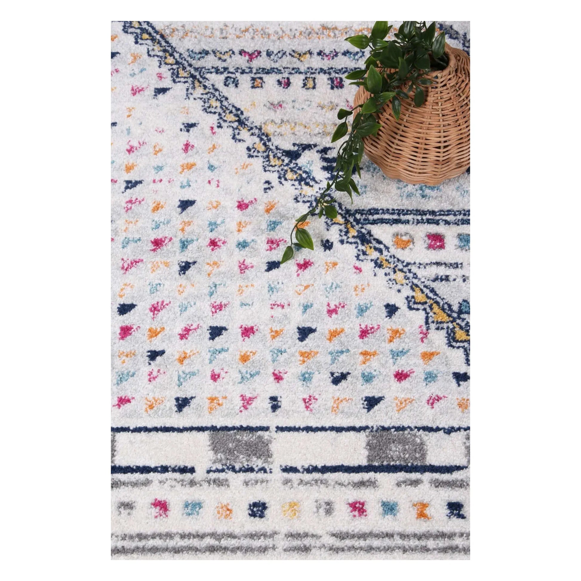 Close-up of Provence rug showing geometric medallion pattern and pink accents
