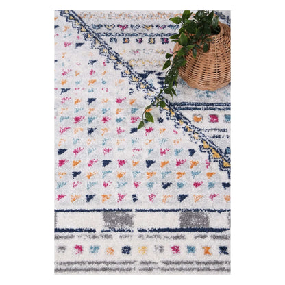 Close-up of Provence rug showing geometric medallion pattern and pink accents