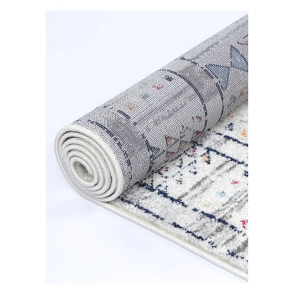 Rolled Provence grey pink rug showing flexible edge and polypropylene pile