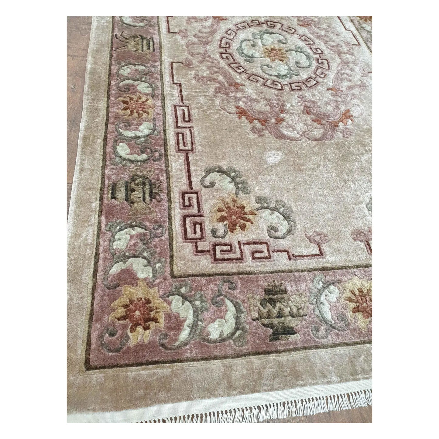 Border and corner detail of vintage Chinese silk rug with floral and geometric motifs