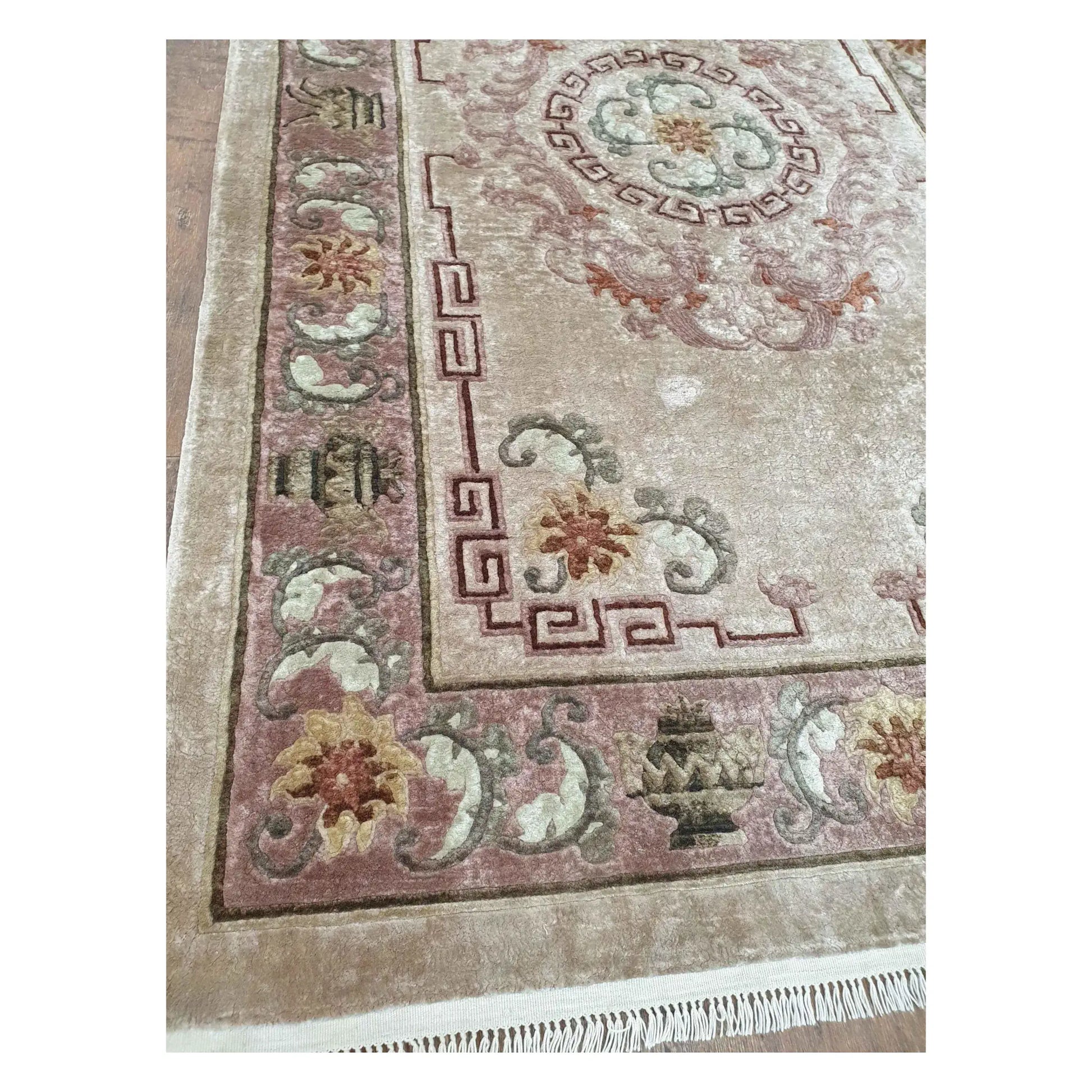 Border and corner detail of vintage Chinese silk rug with floral and geometric motifs
