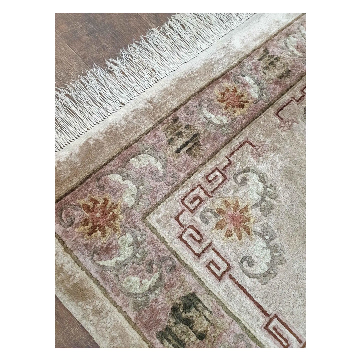 Fringe and corner detail of vintage Chinese hand-knotted silk rug with beige field