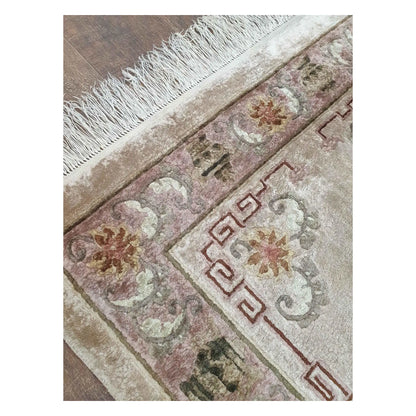 Fringe and corner detail of vintage Chinese hand-knotted silk rug with beige field