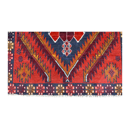 Fringe and end-border detail of Baluchi rug with angular red, navy and ivory motifs
