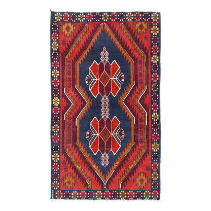 Full view of red Afghan Baluchi hand-knotted wool rug with twin geometric medallions, 186 x 114 cm