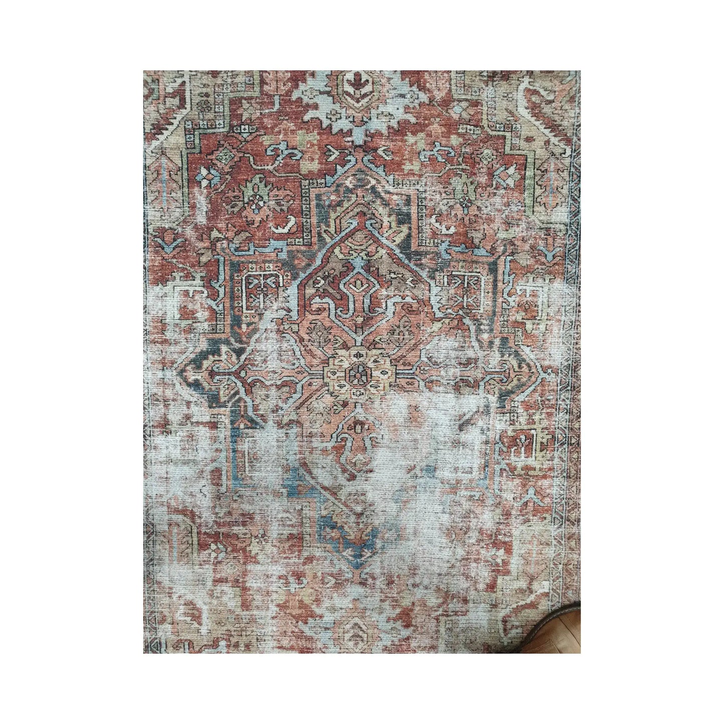 Rust blue ornamental cotton rug shown in front full view