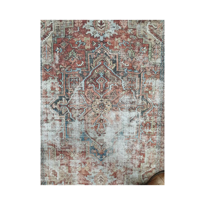 Rust blue ornamental cotton rug shown in front full view
