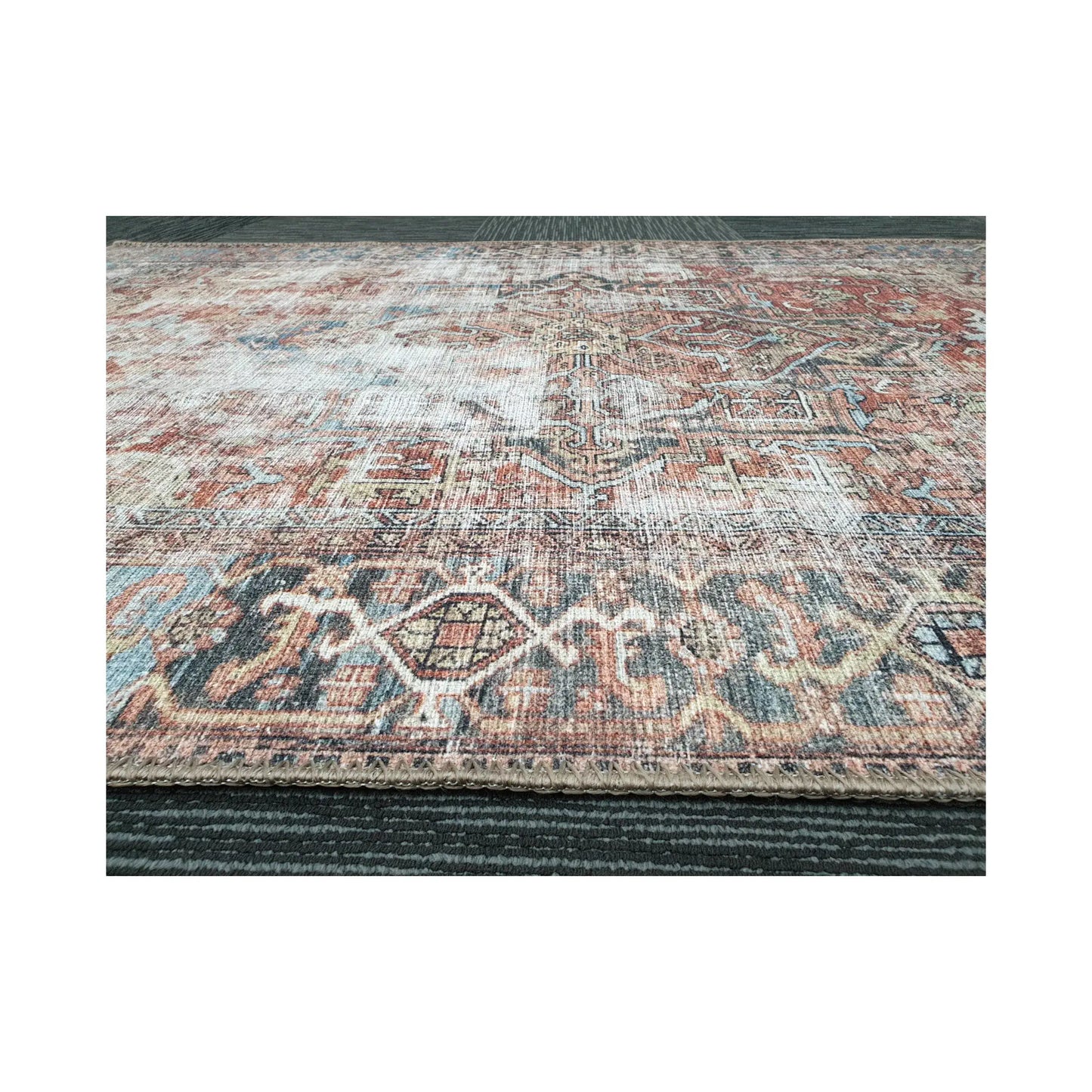 Low-angle close-up of rust blue cotton rug edge and woven surface texture