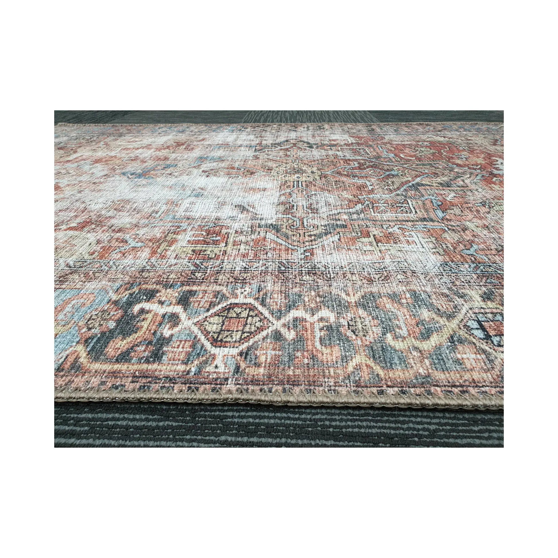 Low-angle close-up of rust blue cotton rug edge and woven surface texture