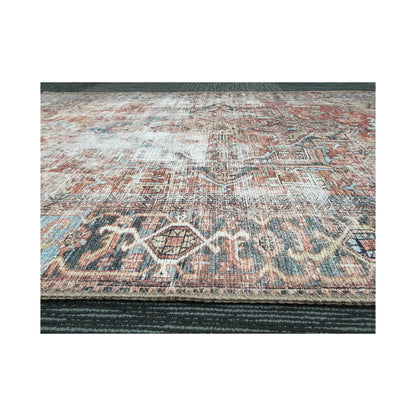 Low-angle close-up of rust blue cotton rug edge and woven surface texture