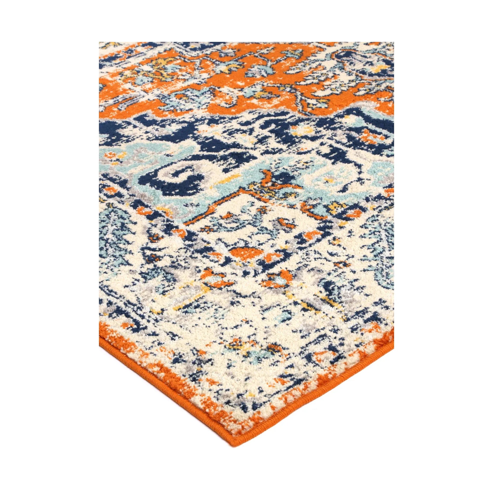 Corner edge detail of Sicily Messina Orange and Blue transitional rug showing bound edge, pile texture and ornate border, 290 x 200 cm