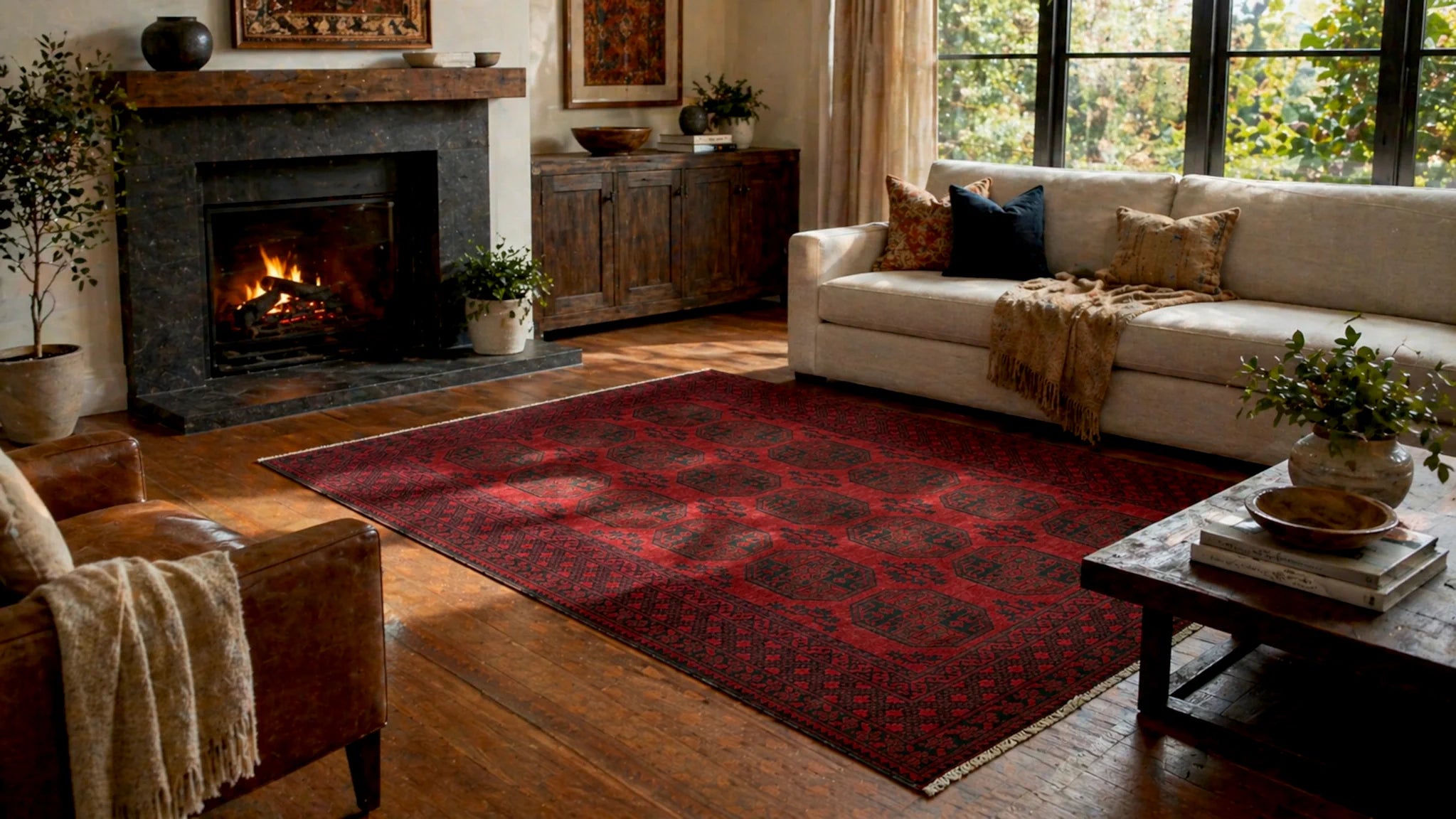 Hand-knotted red wool rug styled in a warm living room with fireplace and wooden flooring