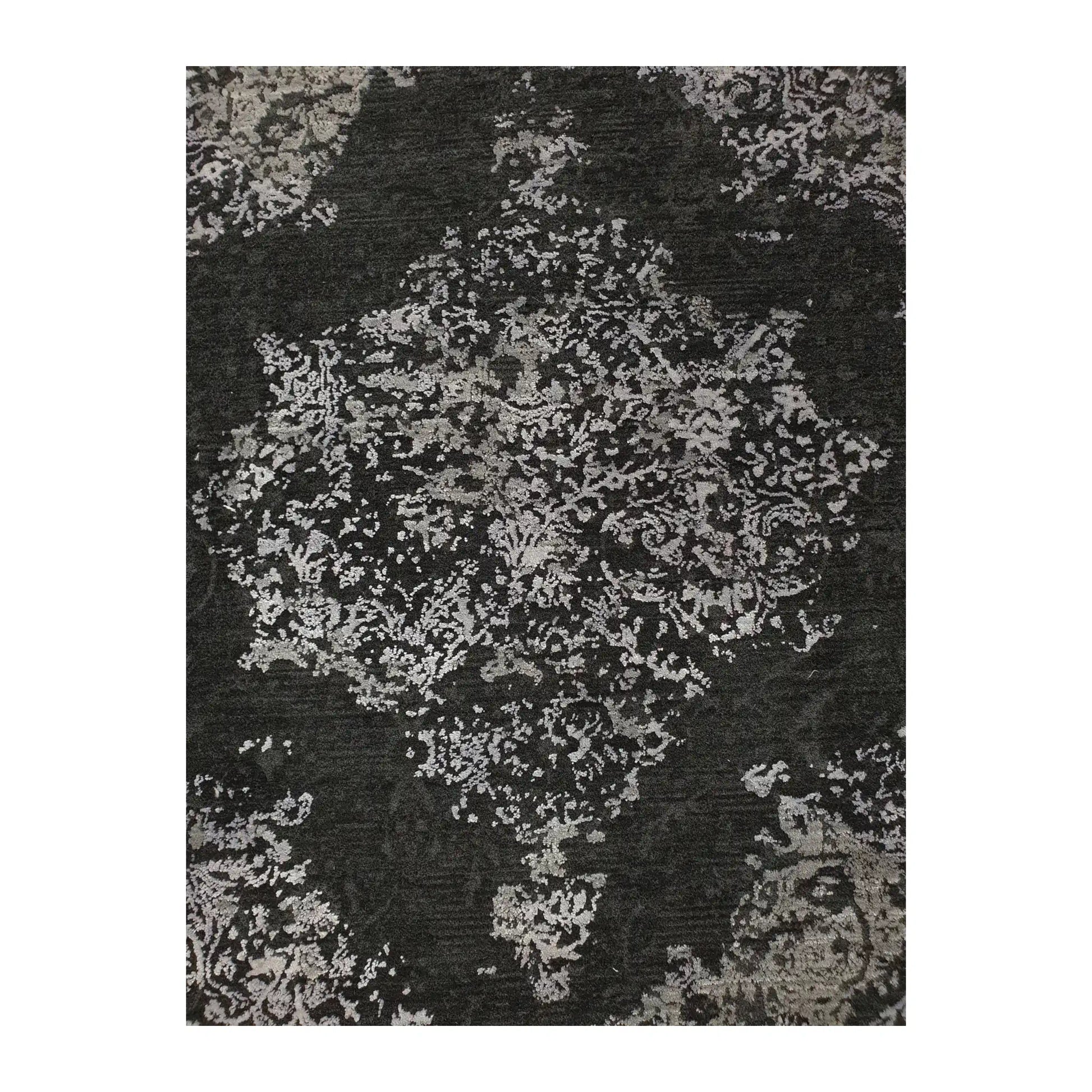Close-up of round rug with silver and charcoal medallion design, 160 cm