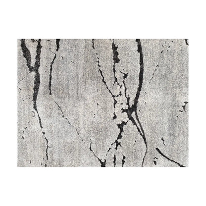 Close-up detail of Stella Grey Runner Rug showing irregular black linear markings on grey textured surface
