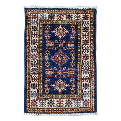 Super Kazak rug 91 x 58 cm full view with blue field, ivory border and central medallion pattern