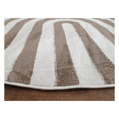 Low-angle close-up of taupe round rug showing surface texture and curved stripe design, 160 cm