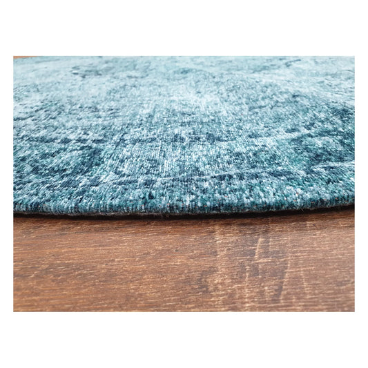 Close-up of teal round chenille polyester rug showing texture and distressed pattern detail, 160 cm