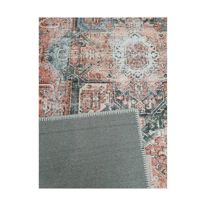 Close-up of terracotta blue cotton rug corner with back and edge detail