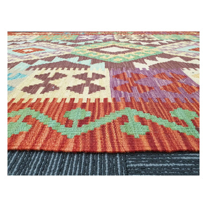 Low-angle close-up of Afghan Chobi Kilim showing wool flatweave texture and multicolour tribal pattern, 143 x 107 cm