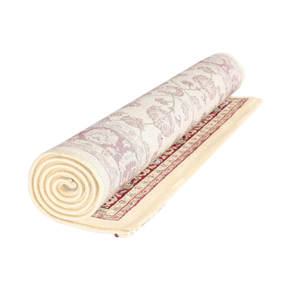 Rolled view of Traditional Julian Cream Red Designer Rug showing cream and red traditional design