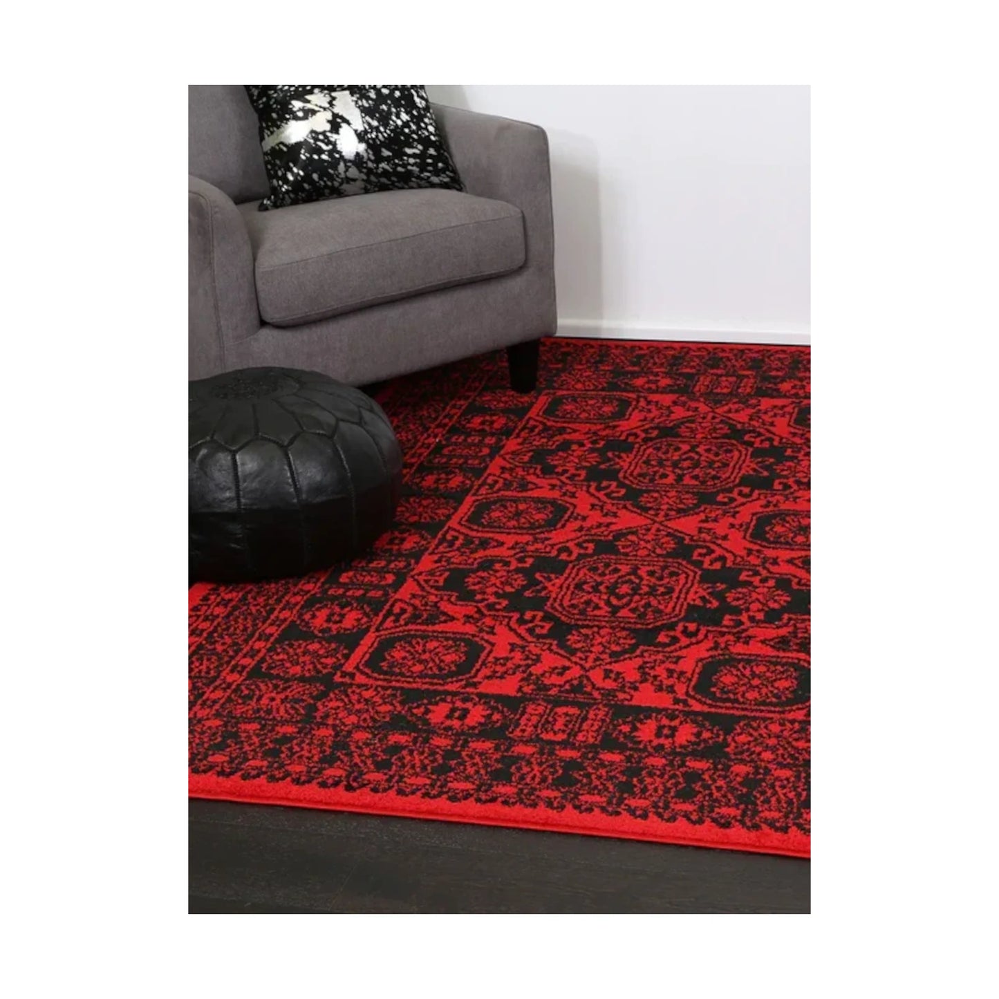 Tribe 10 Red Black rug styled with sofa and dark décor, showing bold red black geometric design, 290 x 200 cm
