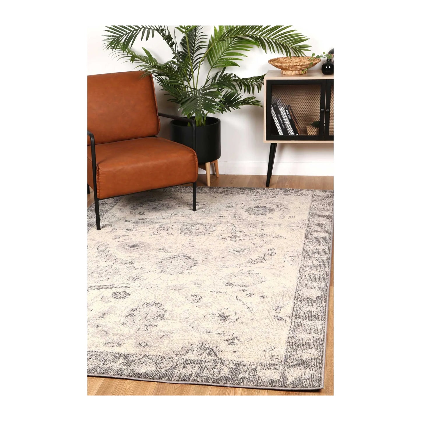 Tulin 12 Warm Cream and Grey transitional rug styled with chair and indoor décor, showing soft neutral pattern, 230 x 160 cm