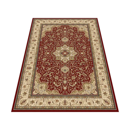 Angled view of the red Isfahan rug showing its central cream medallion, scrolling vines and ivory floral border