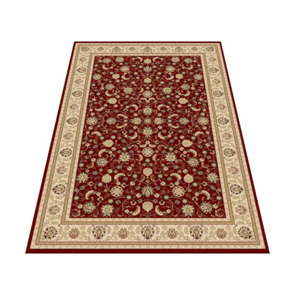 Angled view of the red Isfahan rug showing its floral-vine field, palmettes and ivory ornamental border