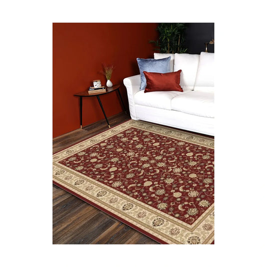 Styled room view of the Turkish Isfahan red rug beside a white sofa on dark timber flooring