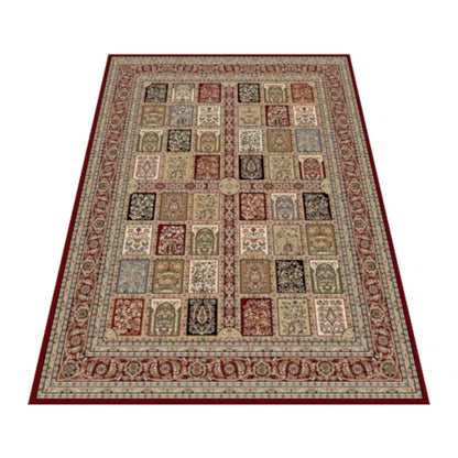 Angled full view of the red and beige Isfahan rug showing its botanical panel grid and floral borders