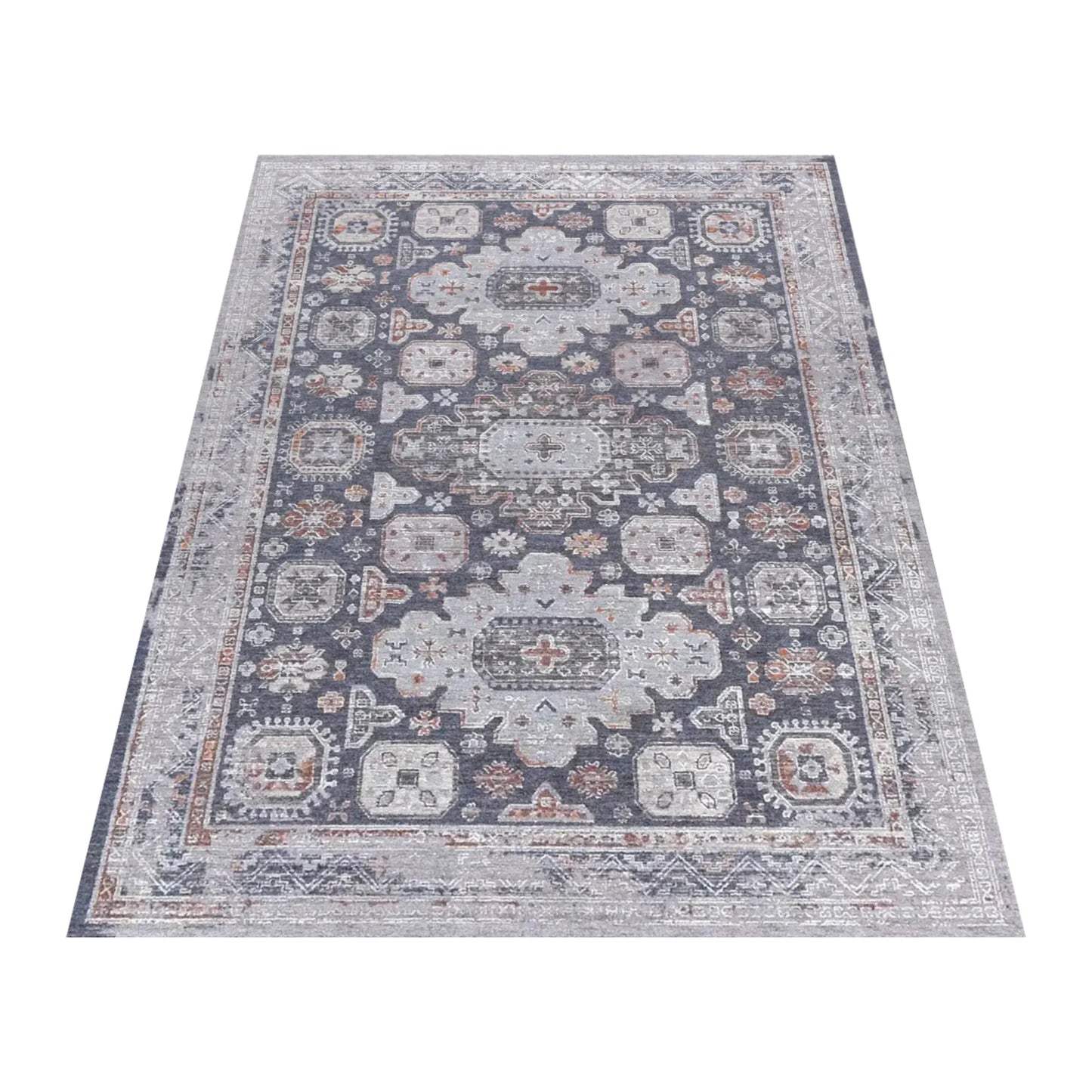 Angled full view of the charcoal Kazaki rug with layered grey borders and muted rust accents