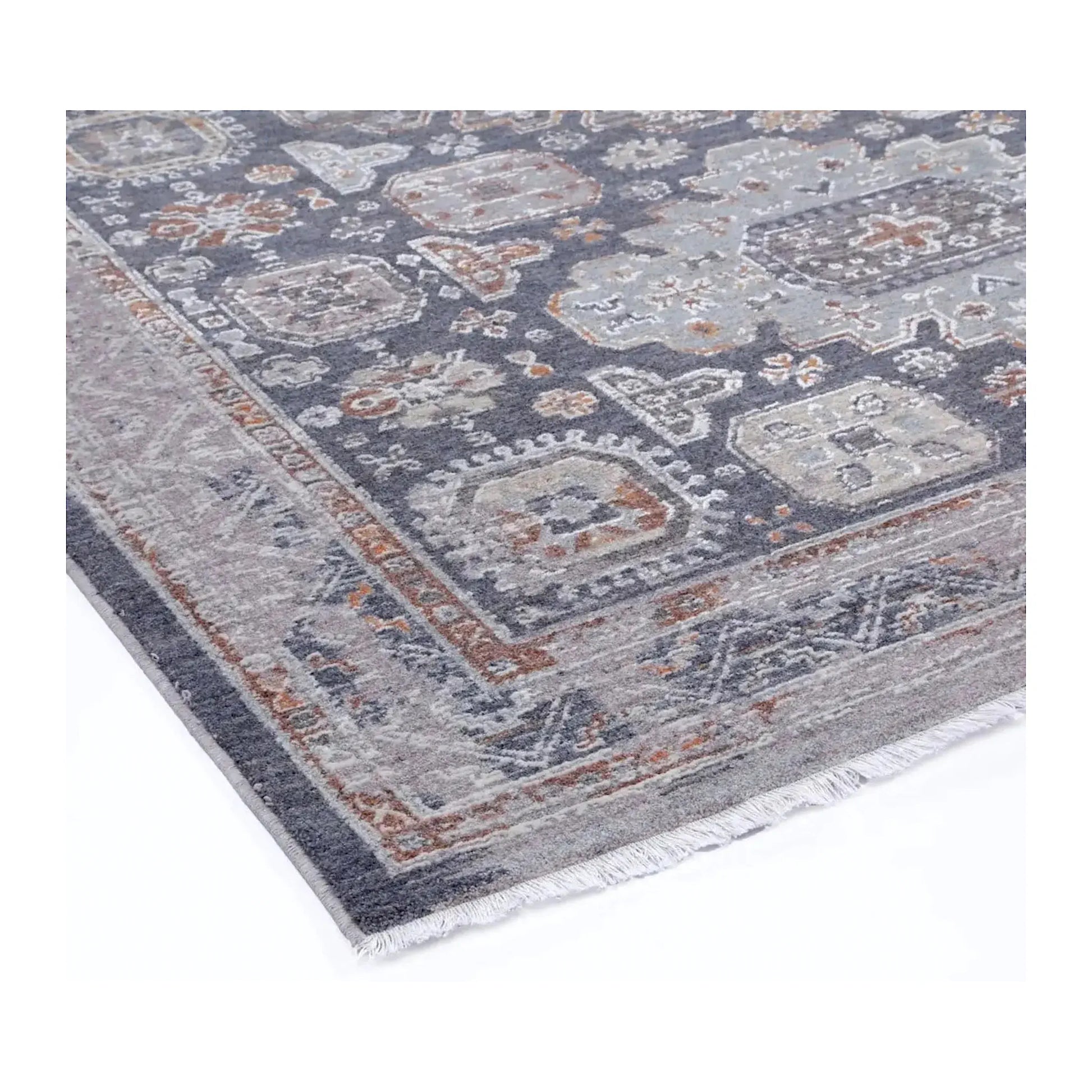 Close view of the geometric pattern, textured surface, grey border and short fringe