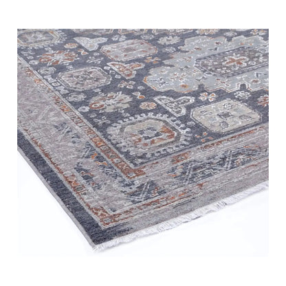 Close view of the geometric pattern, textured surface, grey border and short fringe