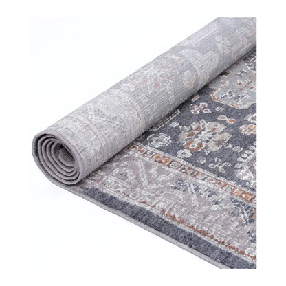 Rolled view showing the front pattern and backing of the Turkish machine-made rug