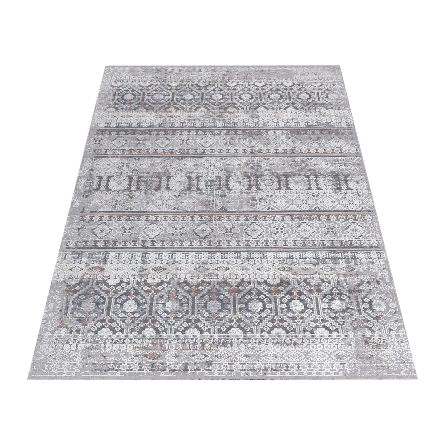 Angled full view of the Turkish Zagros rug showing layered grey geometric stripes and rust accents